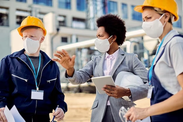 Black female architect civil engineers with protective face masks talking construction site 8601