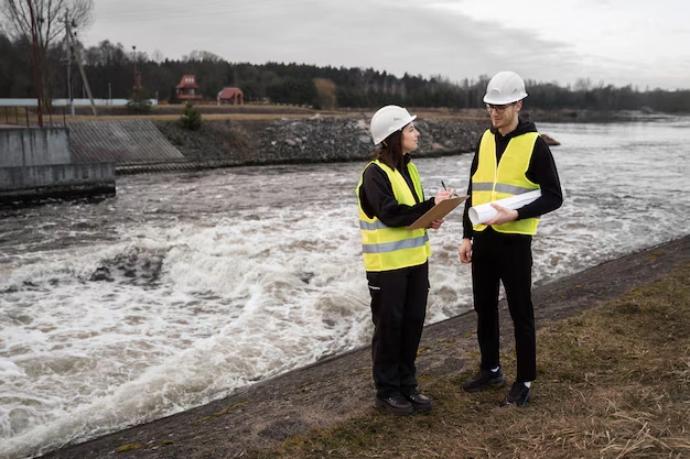 Full shot engineers standing near river 23